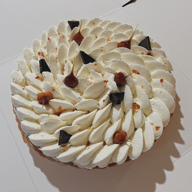 Chestnut tart with piped cream and fruit