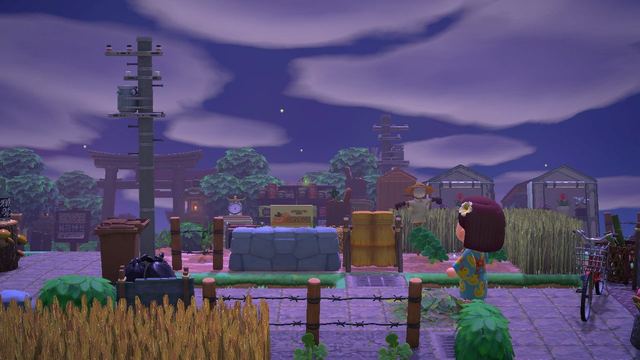 Animal Crossing character standing in a field under a purple evening sky