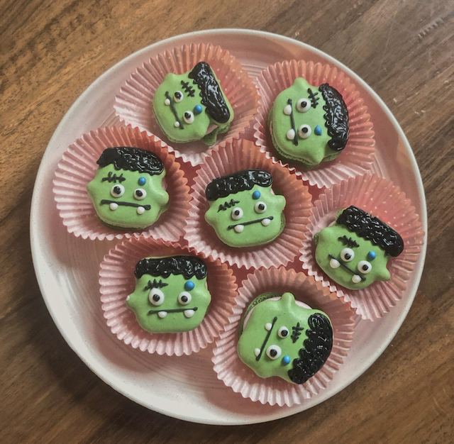 Green macarons decorated as little monsters
